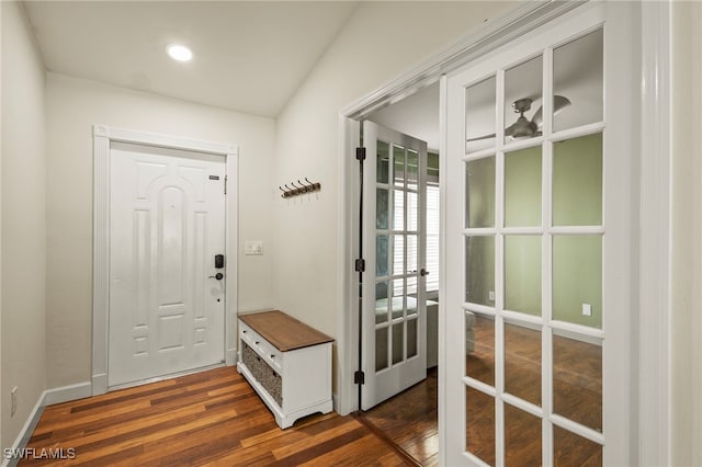 mudroom featuring baseboards and dark wood-style flooring