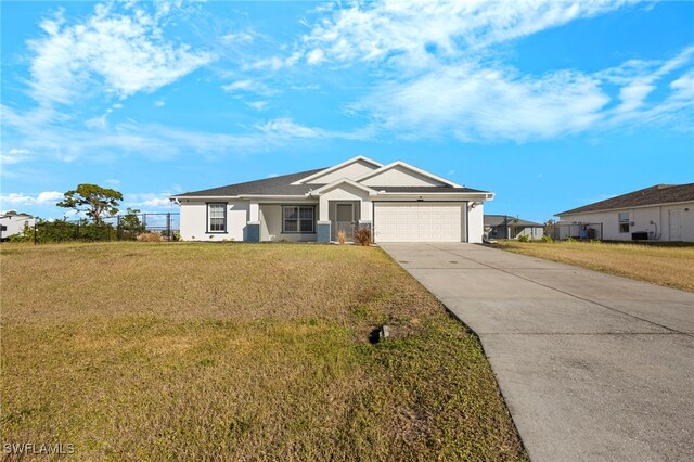 view of front of house with a garage and a front lawn