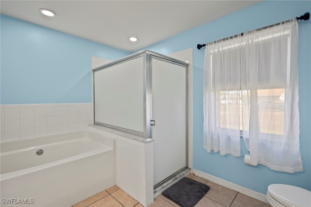 bathroom featuring toilet, tile patterned flooring, recessed lighting, and a shower stall