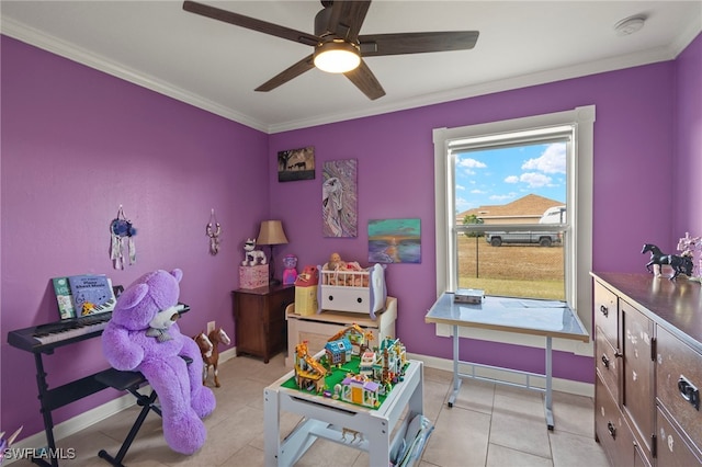 game room featuring ornamental molding, ceiling fan, baseboards, and light tile patterned floors