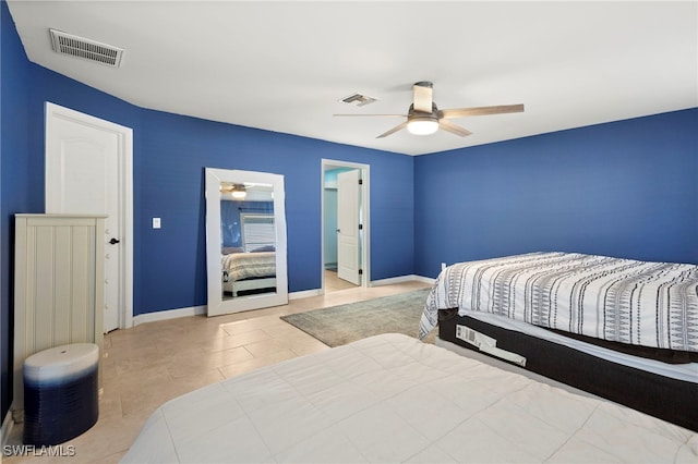 bedroom with visible vents, baseboards, and light tile patterned floors