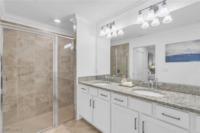 bathroom with tile patterned floors, vanity, crown molding, and walk in shower