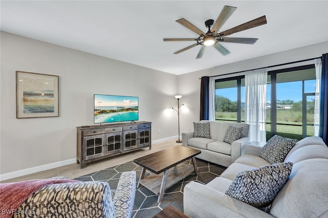 tiled living room featuring ceiling fan