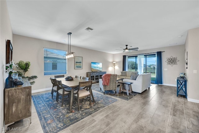 dining room with light wood-type flooring and ceiling fan