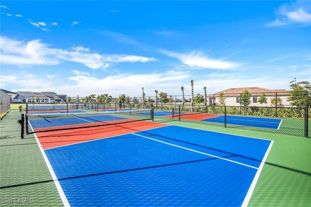 view of tennis court featuring basketball court