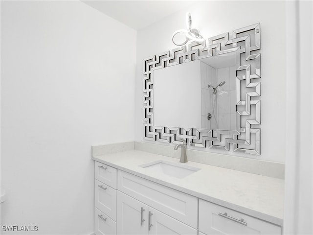 full bathroom with vanity and a shower