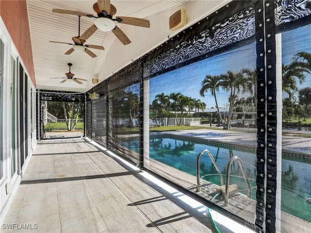 pool featuring a ceiling fan, a patio, and fence