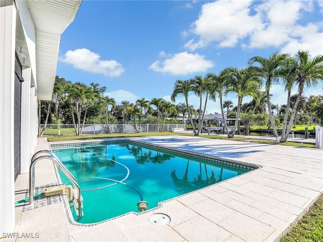 view of pool with a patio area, fence, and a fenced in pool