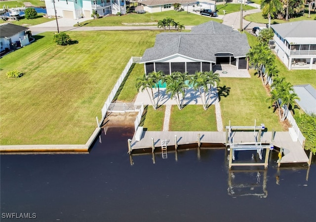 bird's eye view featuring a residential view and a water view