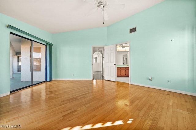 spare room featuring light wood-type flooring and ceiling fan