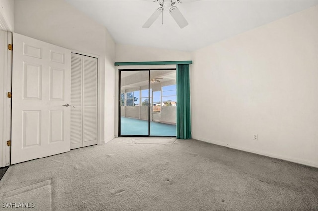 unfurnished bedroom with lofted ceiling, ceiling fan, access to exterior, light colored carpet, and a closet