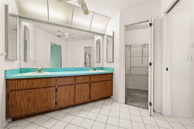 bathroom featuring tile patterned flooring, vanity, and ceiling fan