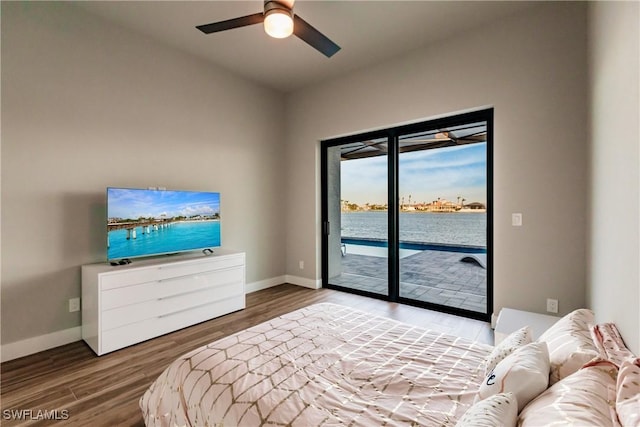 bedroom featuring access to outside, ceiling fan, and hardwood / wood-style flooring