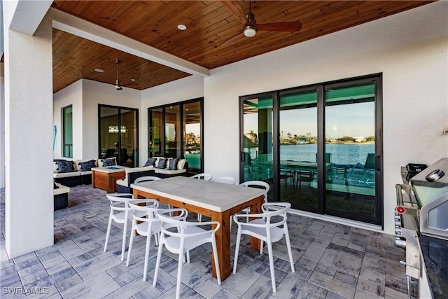 view of patio / terrace with ceiling fan, exterior bar, and an outdoor hangout area