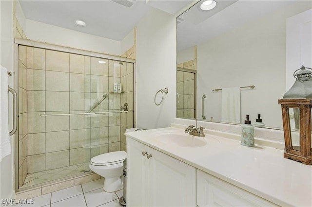 bathroom with toilet, walk in shower, tile patterned floors, and vanity