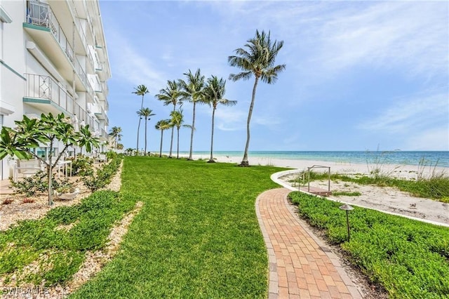 exterior space with a water view and a view of the beach