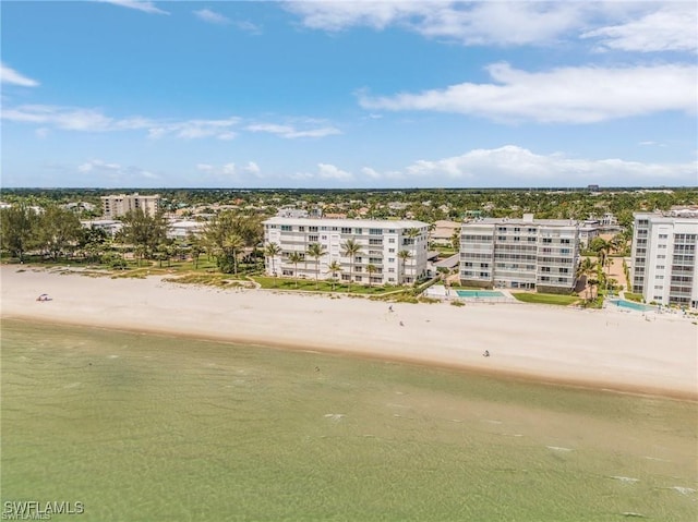 drone / aerial view featuring a view of the beach and a water view