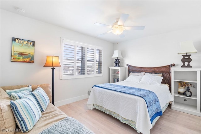 bedroom with ceiling fan and light hardwood / wood-style flooring