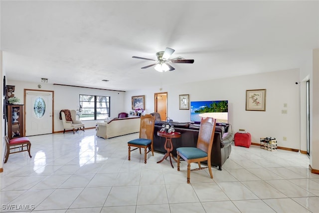 9940 Vanderbilt Dr, Naples, FL 34108 - living room featuring a ceiling fan, baseboards, and light tile patterned floors
