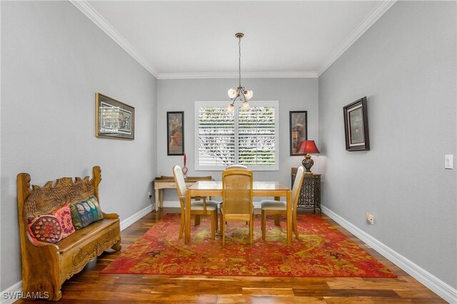 dining area featuring wood-type flooring and ornamental molding