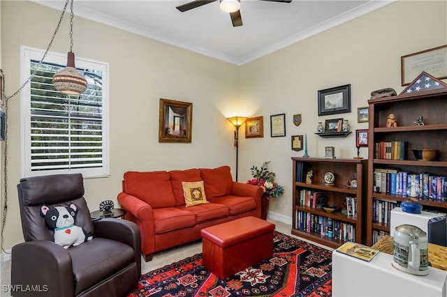 living room featuring ornamental molding and ceiling fan