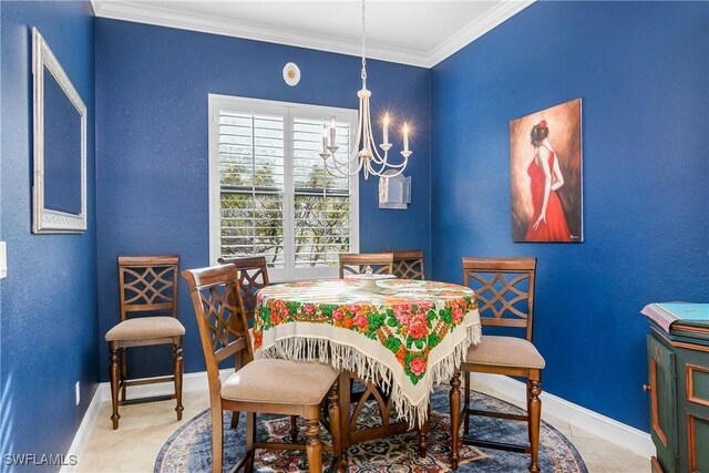 dining space with ornamental molding and a notable chandelier