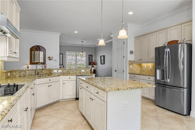 kitchen featuring hanging light fixtures, appliances with stainless steel finishes, a center island, and kitchen peninsula