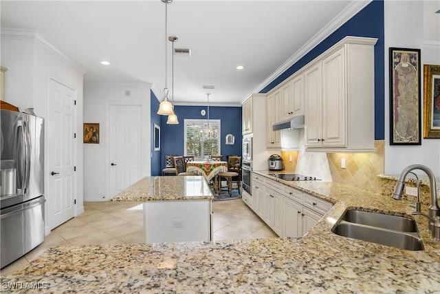 kitchen with stainless steel appliances, pendant lighting, crown molding, sink, and kitchen peninsula