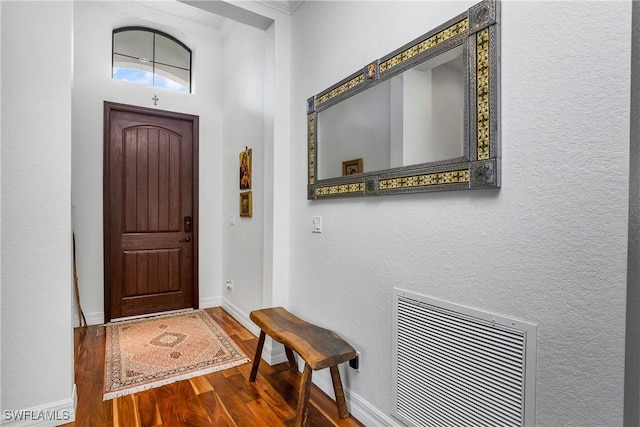 entrance foyer featuring hardwood / wood-style floors