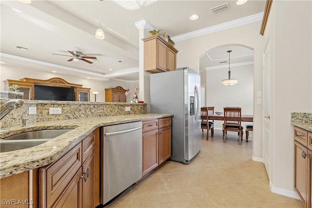 kitchen with ceiling fan, sink, tasteful backsplash, pendant lighting, and appliances with stainless steel finishes