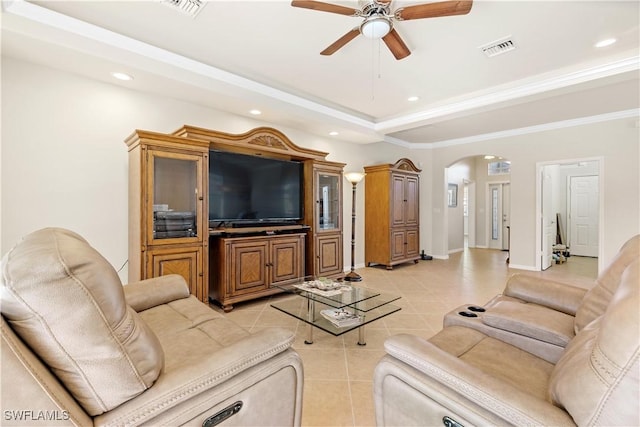 living room featuring ceiling fan, light tile patterned floors, and ornamental molding