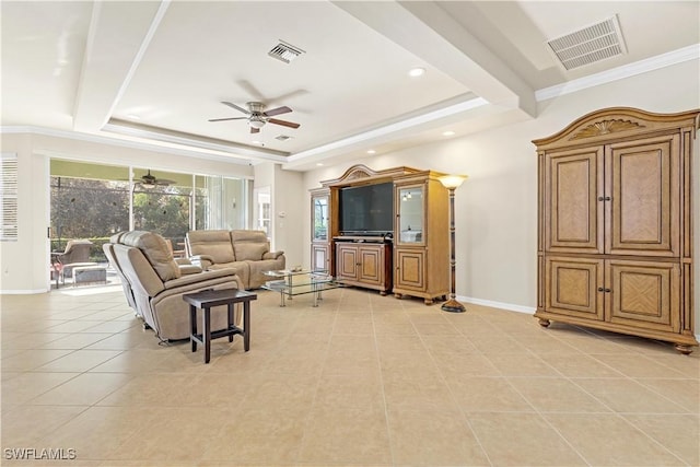 tiled living room with a tray ceiling, ceiling fan, and ornamental molding