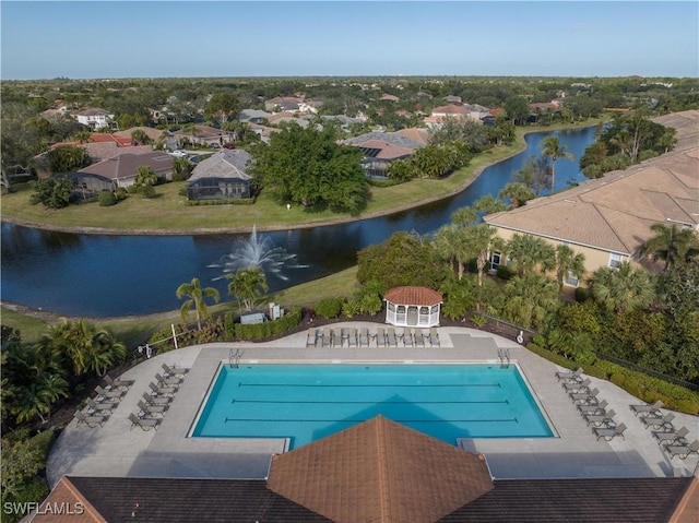 view of swimming pool with a water view