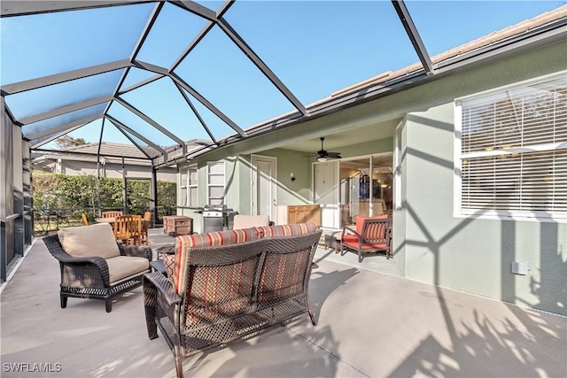 view of patio featuring a lanai, grilling area, ceiling fan, and an outdoor hangout area