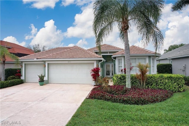 view of front of house with a front lawn and a garage