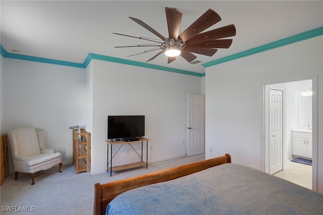 bedroom with light colored carpet, ensuite bath, ceiling fan, and ornamental molding