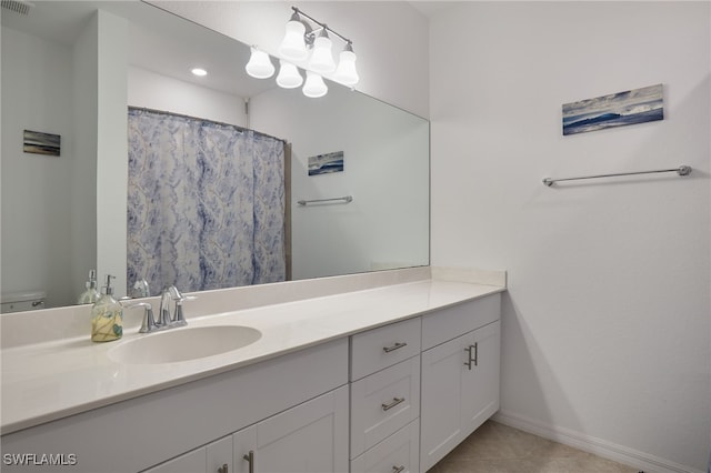 bathroom with tile patterned flooring, vanity, a shower with shower curtain, and toilet