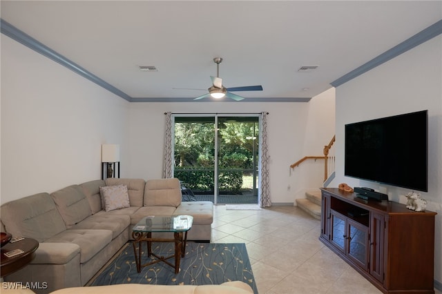 tiled living room featuring ceiling fan and ornamental molding