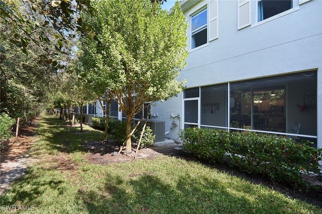 view of yard featuring central AC unit