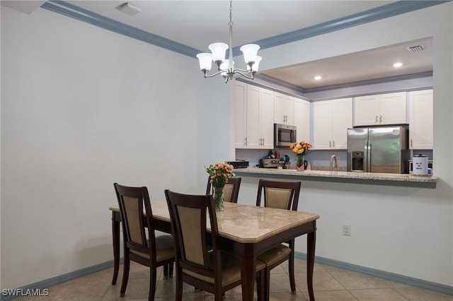 tiled dining space with crown molding and a chandelier