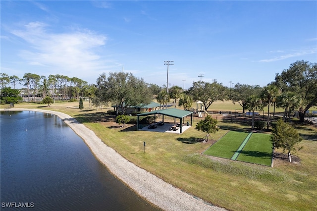 birds eye view of property with a water view