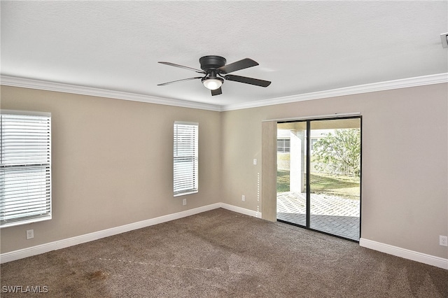 carpeted empty room featuring a textured ceiling, ceiling fan, and crown molding