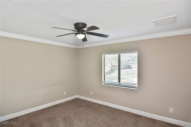 carpeted spare room with ceiling fan and crown molding