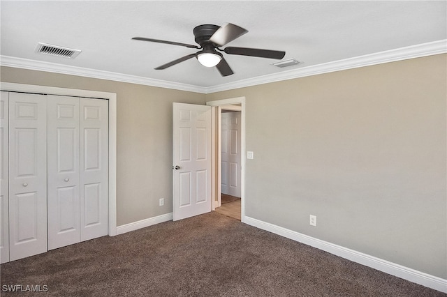 unfurnished bedroom with ceiling fan, crown molding, and carpet