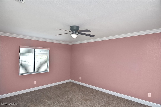 carpeted empty room featuring ceiling fan, a textured ceiling, and ornamental molding