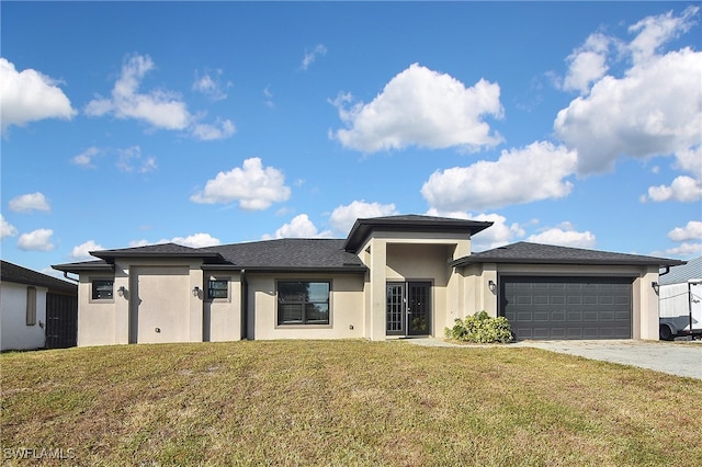 prairie-style home with a garage and a front yard