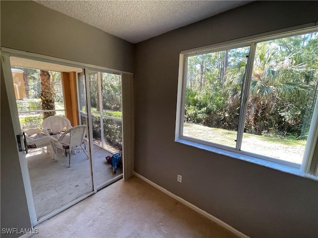 interior space with a textured ceiling