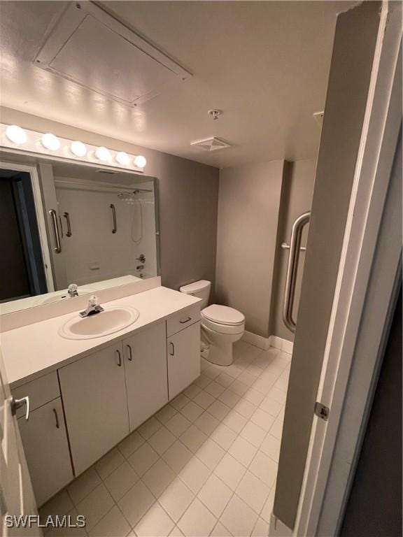 bathroom featuring tile patterned flooring, a shower, vanity, and toilet