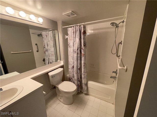 full bathroom with tile patterned floors, shower / bath combo, toilet, and vanity