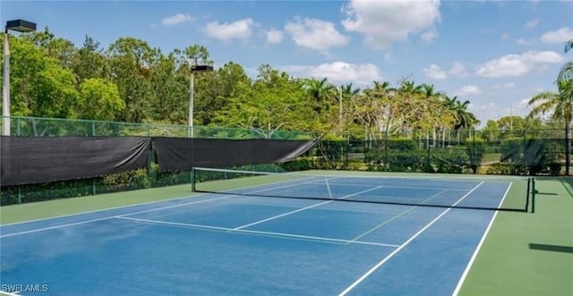 view of tennis court featuring basketball court